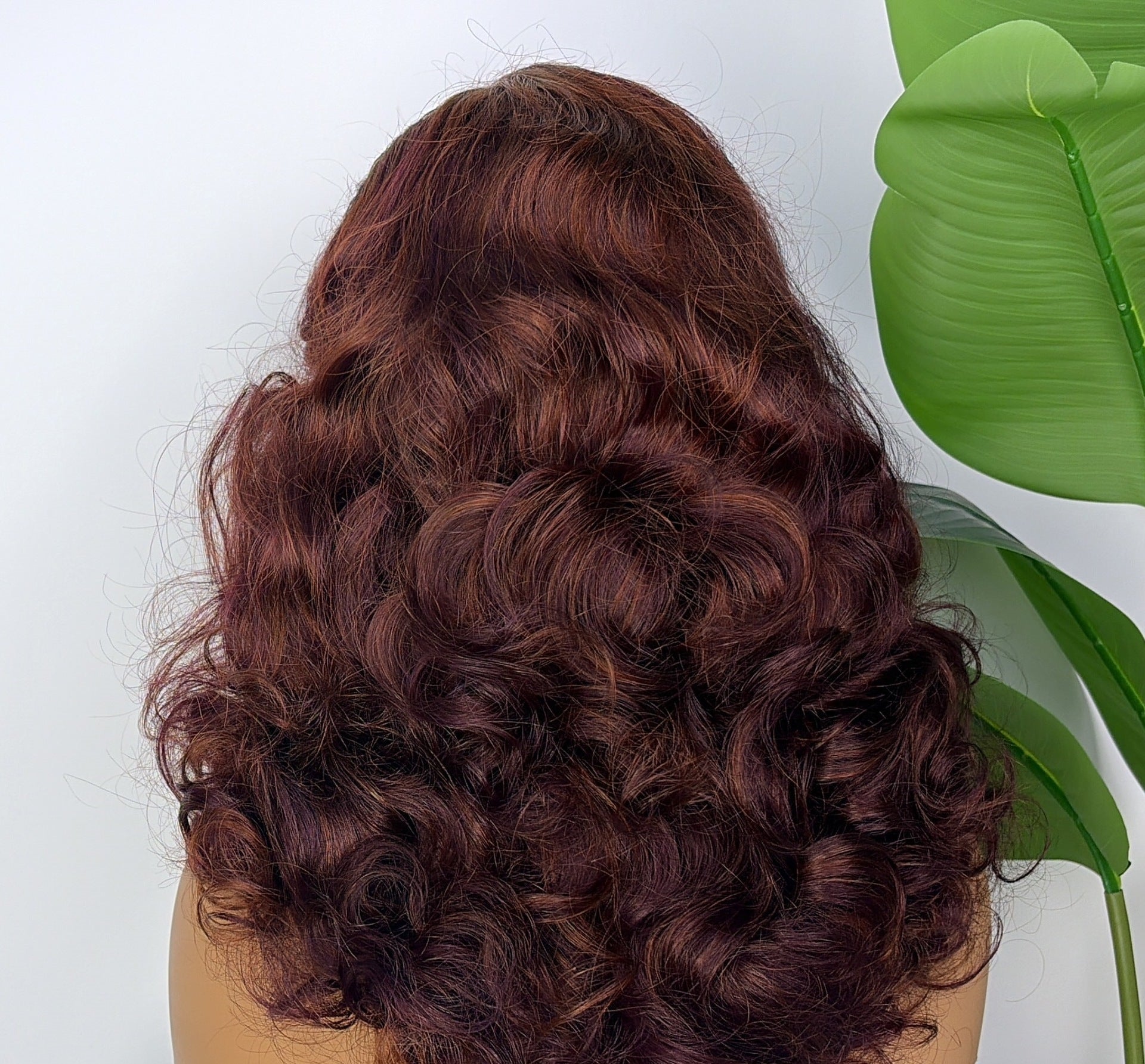 Indian Remy bouncy curl wig in auburn burgundy, 20 inch, shown from the back